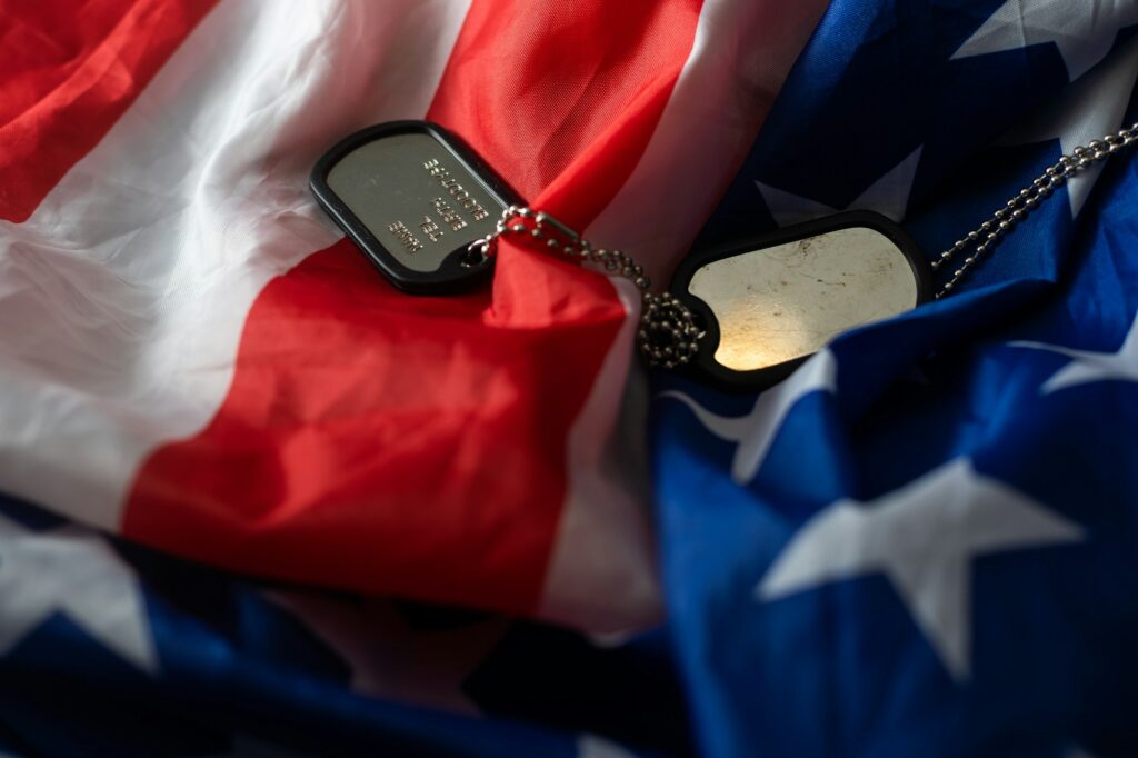 American flag and soldiers tags on background. Veterans Day Concept.