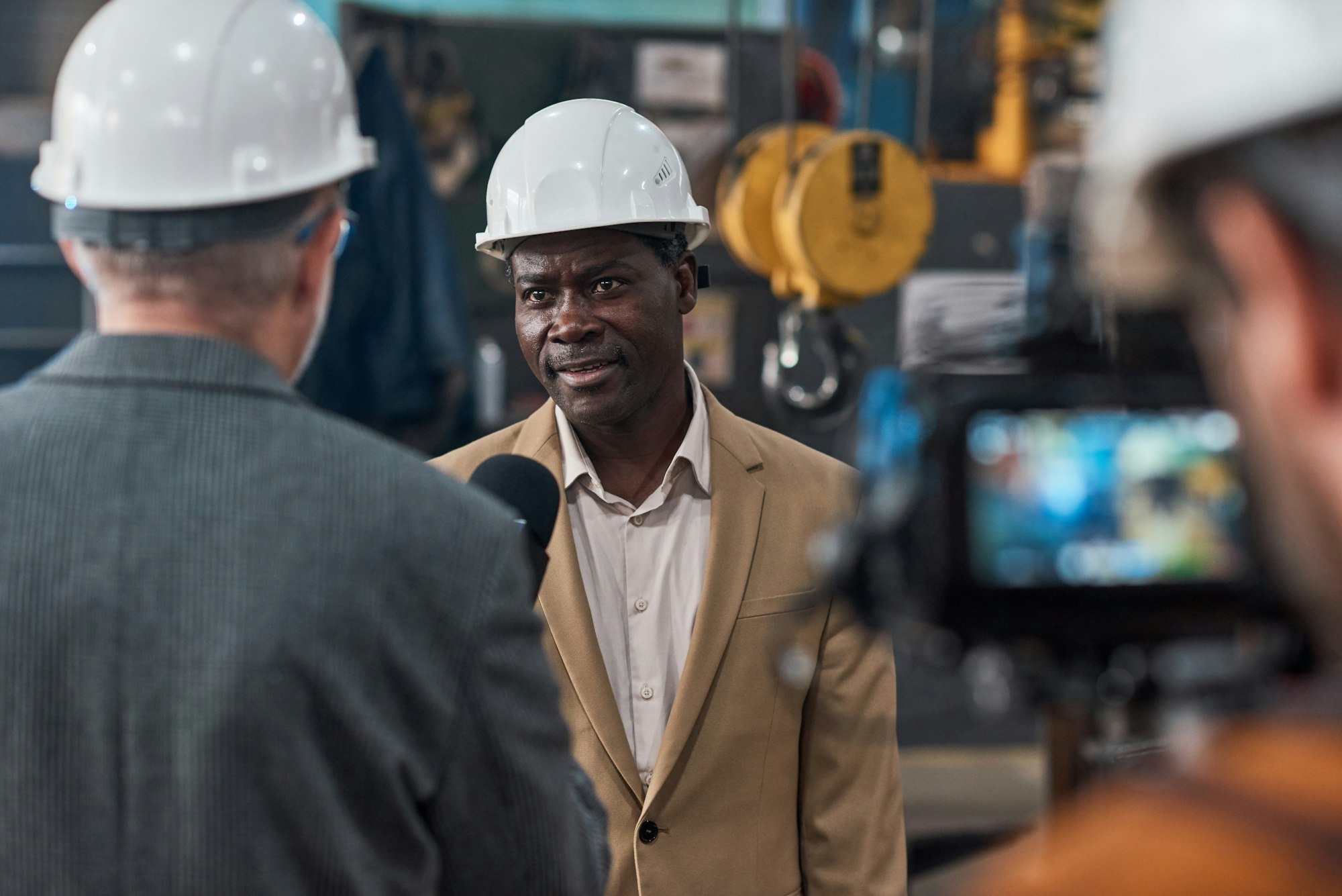 Foreign engineer giving an interview to reporter